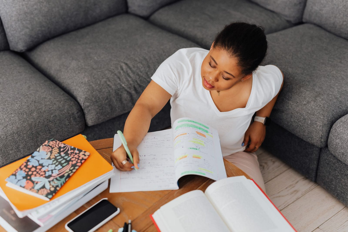 Student studying with notebooks